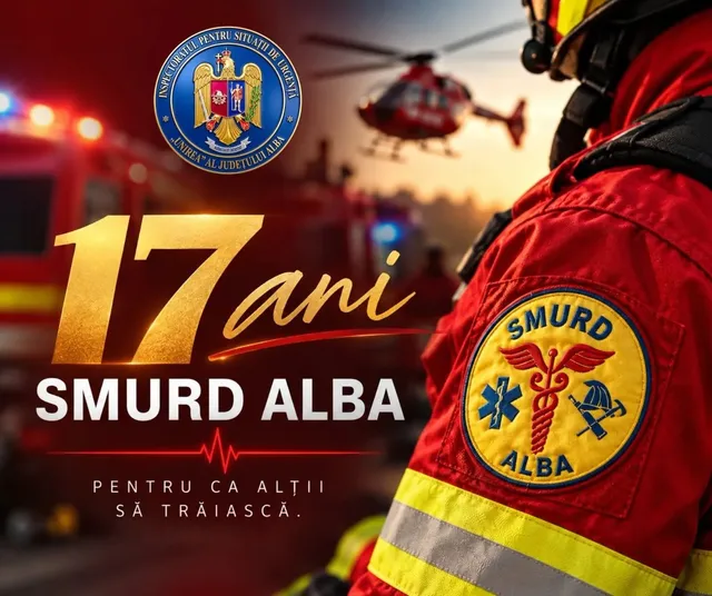 În prim-plan se vede o uniformă roșie cu benzi galbene și ecuson SMURD Alba; în fundal apar un elicopter și vehicule.